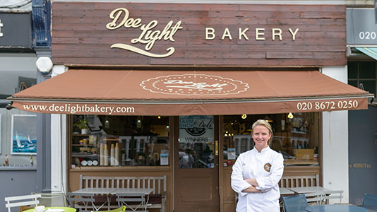Dee outside her business, Dee Light Bakery